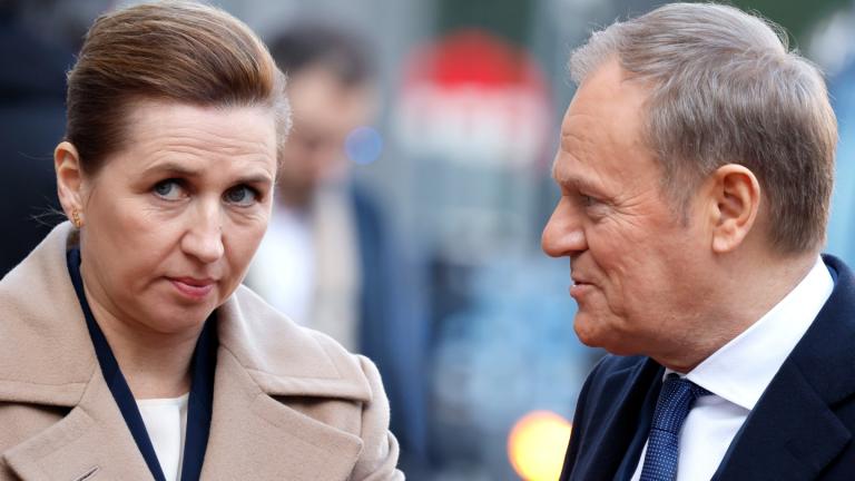 Denmark's Prime Minister Mette Frederiksen, left, speaks with Poland's Prime Minister Donald Tusk as they arrive for an EU summit at the Egmont Palace in Brussels, Monday, Feb. 3, 2025. (AP Photo/Geert Vanden Wijngaert)
