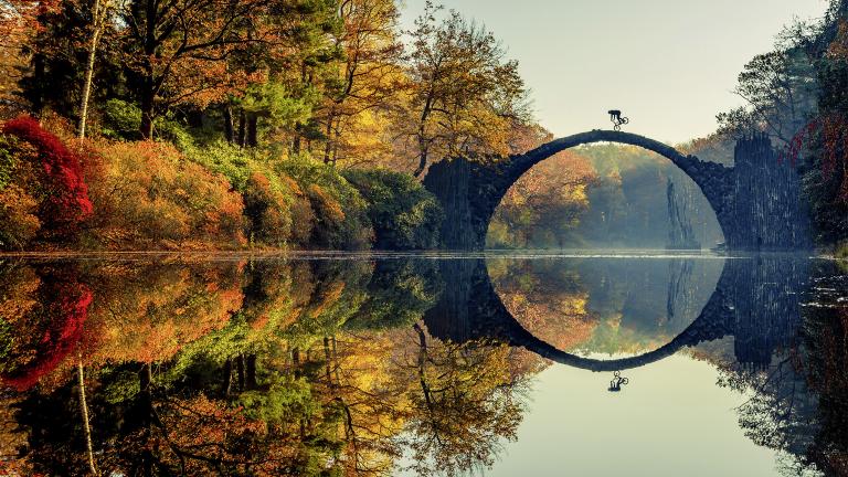 Lorenz Holder of Germany was the overall winner of the 2016 Red Bull Illume contest. The photo shows Senad Grosic ride his bike over a bridge in an autumnal Gablenz, Germany. (Lorenz Holder / Red Bull Illume)
