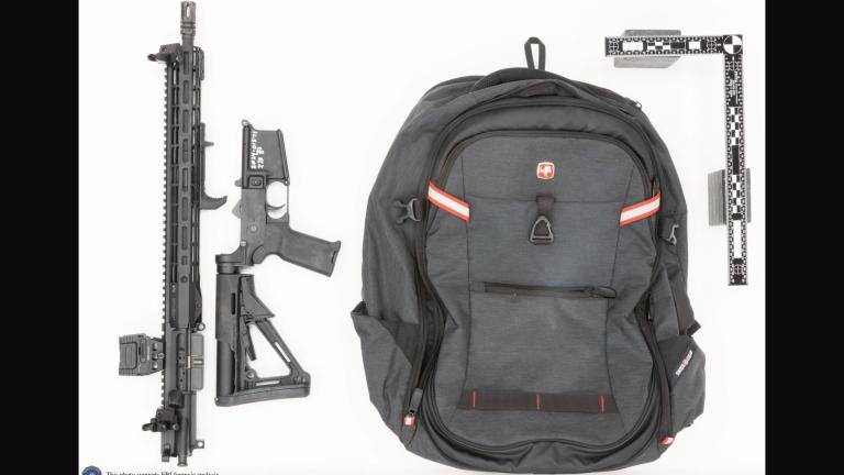 Thomas Crooks’ rifle broken down as was likely done for transport and the backpack recovered onsite. Note: Markings on lower receiver are by the FBI. (FBI via CNN Newsource)