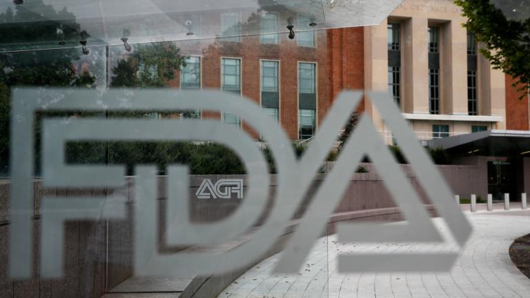 FILE - The U.S. Food and Drug Administration building behind FDA logos at a bus stop on the agency's campus in Silver Spring, Md, Thursday, Aug. 2, 2018. (Jacquelyn Martin / AP Photo, File)