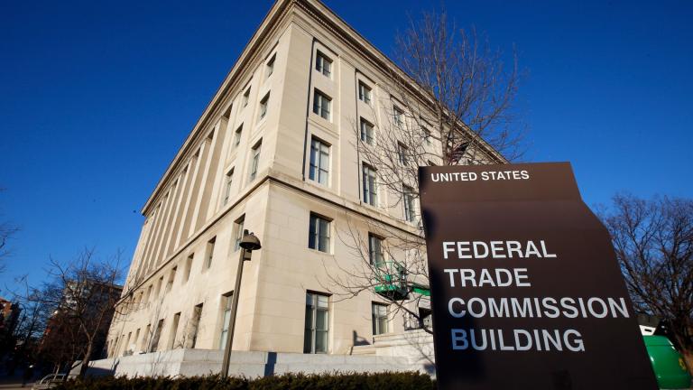 FILE - A sign stands outside the Federal Trade Commission building, Jan. 28, 2015, in Washington. (Alex Brandon / AP Photo, File)