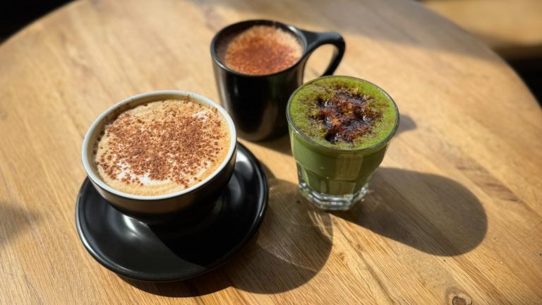 The fall drink menu at Two Mile Coffee Bar in Beverly includes (from left to right) the Pumpkin Spice Latte, the South Cider and the Matcha Blanca, featuring a bruleed coconut sugar topping. (Nicole Cardos / WTTW News)