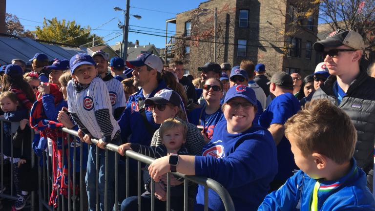 Cubs fans line Waveland Avenue for a chance to see the World Series champs Friday morning. (Evan Garcia / Chicago Tonight)