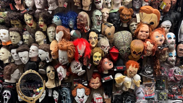 A wall of masks at Fantasy Costumes in the Portage Park neighborhood. (Nicole Cardos / WTTW News)