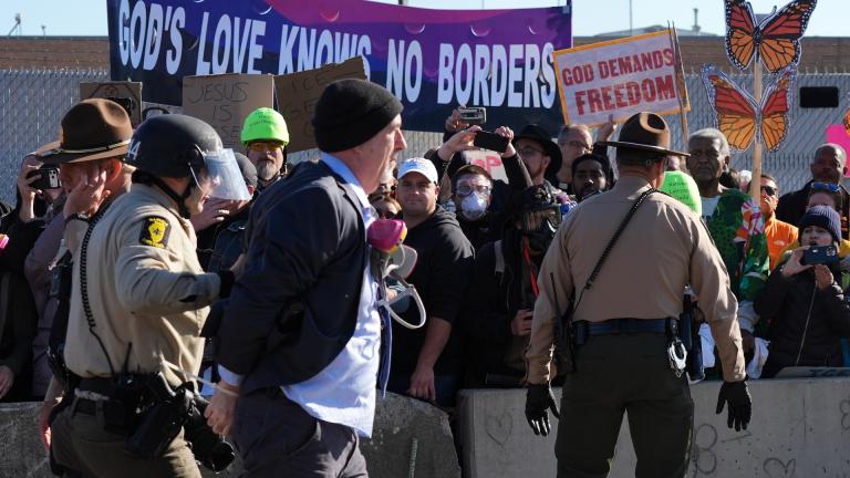 Cook County Sheriff Police guard as Illinois State police detain a protester outside an ICE processing facility in the Chicago suburb of Broadview, Ill., Friday, Nov. 14, 2025. (AP Photo/Nam Y. Huh)