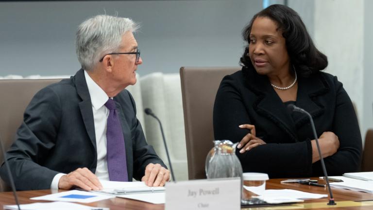 Federal Reserve Chairman Jerome Powell, left, talks with Board of Governors member Lisa Cook, right, during an open meeting of the Board of Governors at the Federal Reserve, June 25, 2025, in Washington. (AP Photo / Mark Schiefelbein, File)