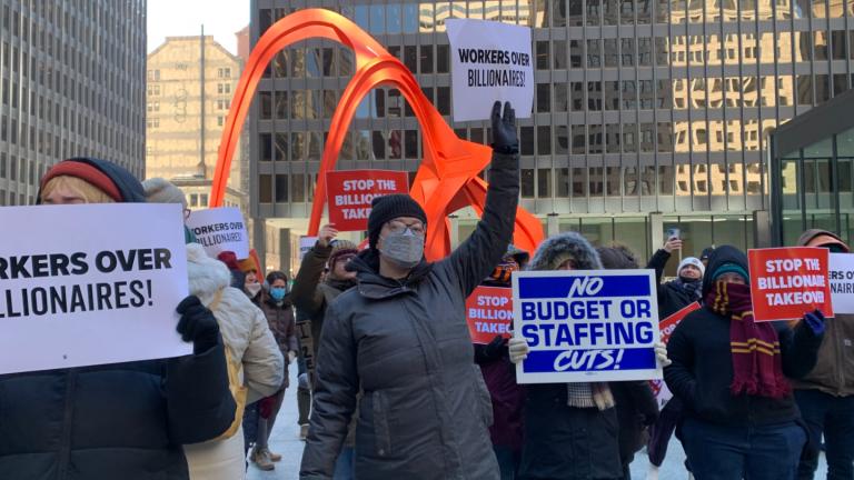 People gather at downtown’s Federal Plaza on Feb. 18, 2025, to push back on President Donald Trump’s sweeping efforts to reduce the size of the federal workforce. (Eunice Alpasan / WTTW News)
