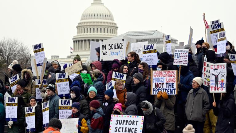 Medical researchers from universities and the National Institutes of Health rally near the Health and Human Services headquarters to protest federal budget cuts Wednesday, Feb. 19, 2025, in Washington. (John McDonnell / AP Photo)