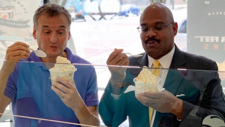Phil Rosenthal, left, digs into peach cobbler and ice cream during the Chicago episode of "Somebody Feed Phil." (Courtesy of Shawn Michelle's Ice Cream)