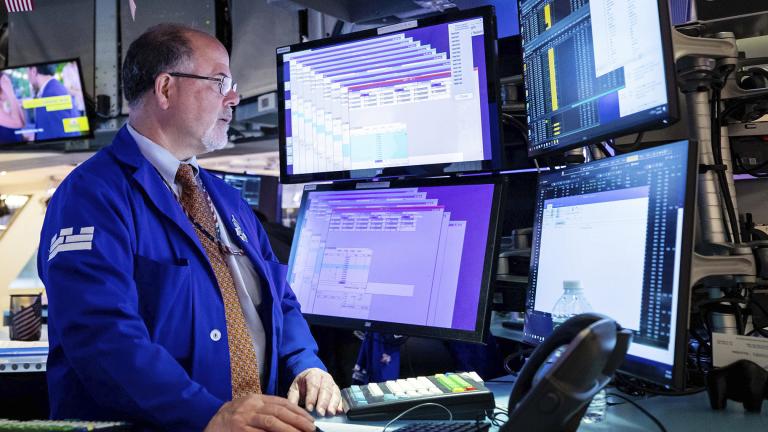 In this photo provided by the New York Stock Exchange, specialist Douglas Johnson works on the trading floor, Monday, May 23, 2022. (David L. Nemec / New York Stock Exchange via AP)