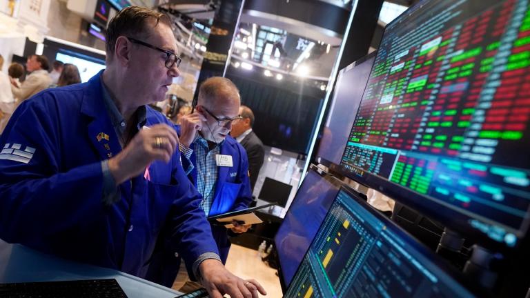 Specialist Patrick King, left, works at his post on the floor of the New York Stock Exchange, Tuesday, Aug. 6, 2024. (AP Photo / Richard Drew)