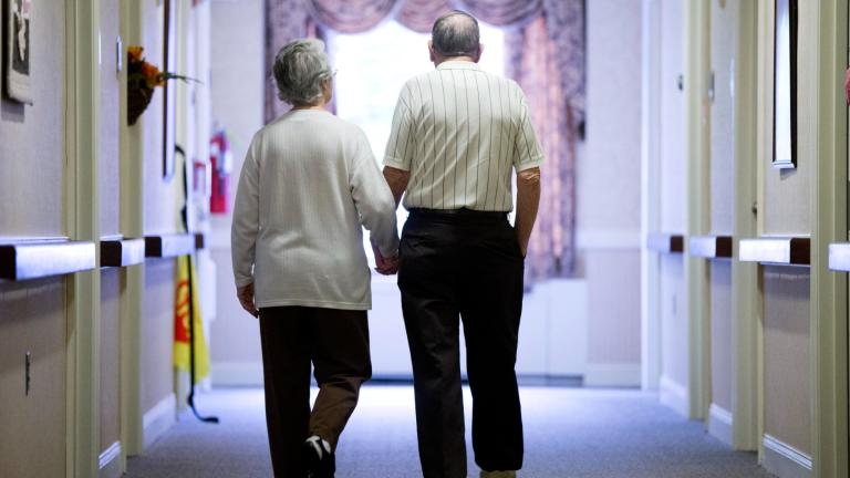 FILE – A couple walks down a hall on Nov. 6, 2015, in Easton, Pa. (Matt Rourke / AP Photo, File)