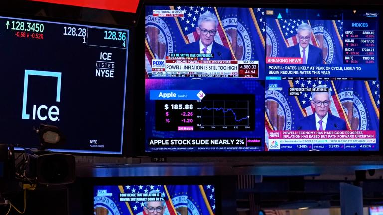 FILE - Television screens on the floor of the New York Stock Exchange show the news conference of Federal Reserve Chair Jerome Powell, Wednesday, Jan. 31, 2024. (Richard Drew / AP Photo, File)