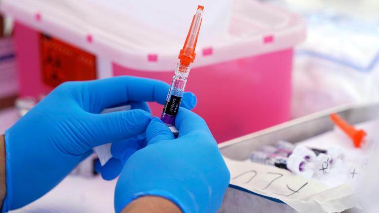 A flu vaccine is readied at the L.A. Care and Blue Shield of California Promise Health Plans’ Community Resource Center where they were offering members and the public free flu and COVID-19 vaccines Friday, Oct. 28, 2022, in Lynwood, Calif. (AP Photo / Mark J. Terrill, File)
