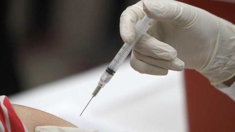 In this Thursday, Jan. 23, 2020, file photo, a patient receives an influenza vaccine in Mesquite, Texas. (AP Photo / LM Otero, File)