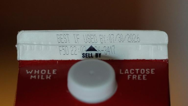A Best If Used By date is stamped above a Sell By label on a milk carton, Tuesday, June 30, 2026, in San Francisco. (AP Photo / Jeff Chiu)