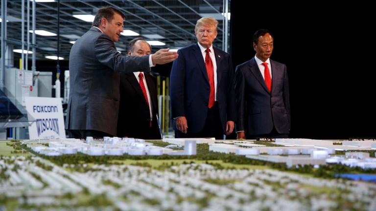 In this June 28, 2018 photo, President Donald Trump takes a tour of Foxconn with Foxconn chairman Terry Gou, right, and CEO of SoftBank Masayoshi Son in Mt. Pleasant, Wis. (AP Photo / Evan Vucci, File)