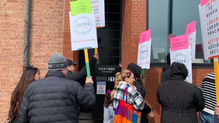 A group of former Foxtrot and Dom’s Kitchen and Market employees, and supporters, rallied in front of the Foxtrot Commissary in Pilsen on April 26, 2024, to demand back pay following abrupt closures of all Foxtrot and Dom’s stores. (Eunice Alpasan / WTTW News)