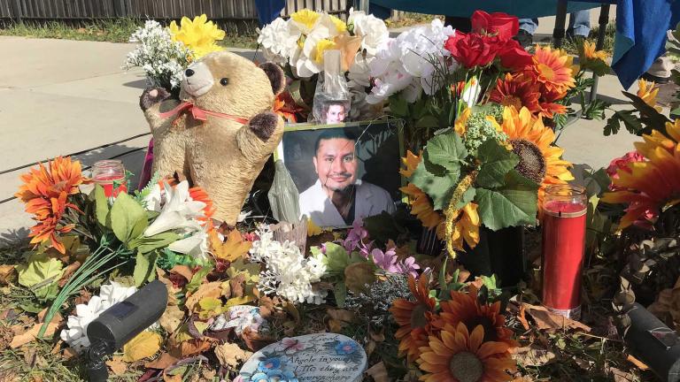 The family of Frank Aguilar added new flowers and a new photo to his memorial at the corner of South Hamlin and West 32nd Street to honor his life on Sunday, Nov. 1, 2020, the eve of Day of the Dead. (Ariel Parrella-Aureli / WTTW News)
