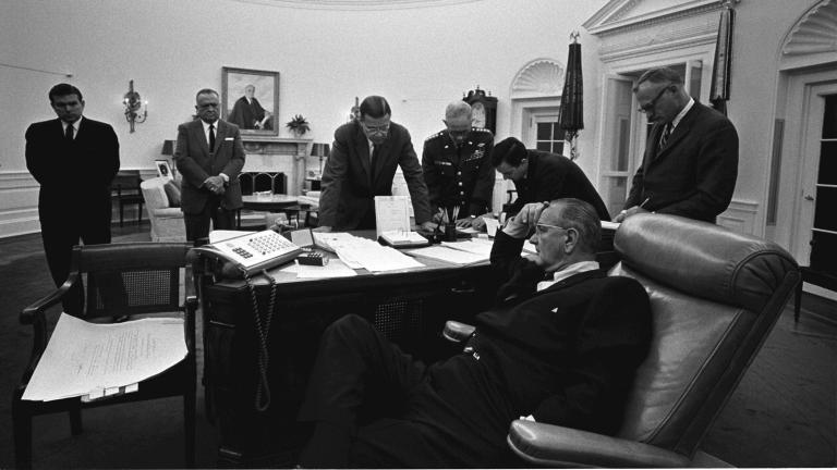 President Lyndon B. Johnson, seated, discusses the 1967 Detroit riot with members of his staff in the Oval Office. (LBJ Library photo by Yoichi Okamoto)