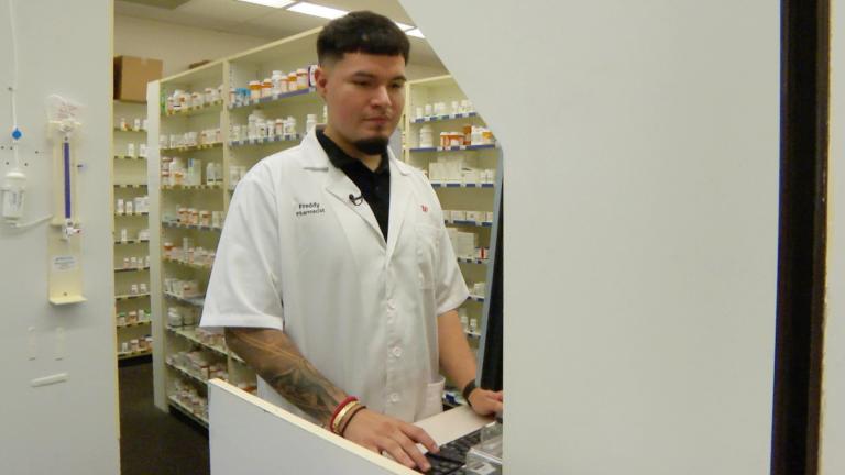 Freddy Gomez, 26, is a first-generation Mexican American who works as a Walgreens pharmacy manager on the Northwest Side. (WTTW News)