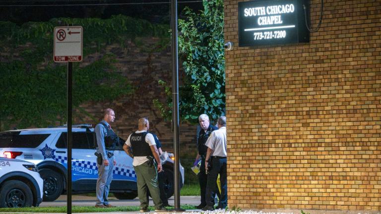 Chicago police investigate South Chicago Chapel after authorities discovered dozens of decomposing bodies in the funeral home's basement on Thursday, Aug. 6, 2026. (Tyler Pasciak LaRiviere / Chicago Sun-Times via AP)