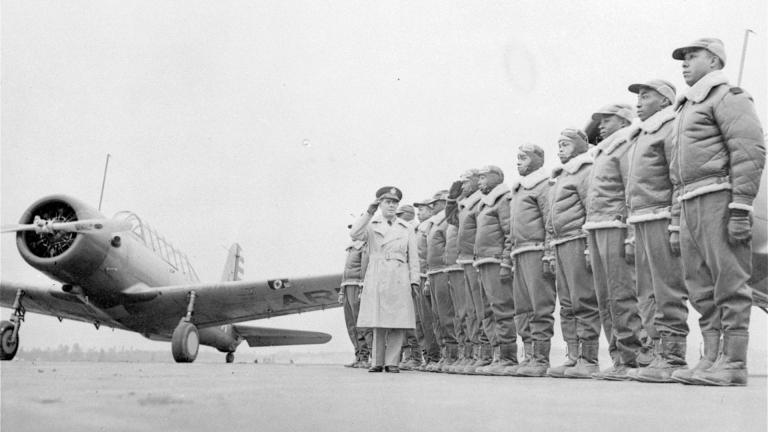 Major James A. Ellison, left, returns the salute of Mac Ross of Dayton, Ohio, as he inspects the cadets at the Basic and Advanced Flying School for Black United States Army Air Corps cadets at the Tuskegee Institute in Tuskegee, Ala., in Jan. 23, 1942. (AP Photo / U.S. Army Signal Corps, File)