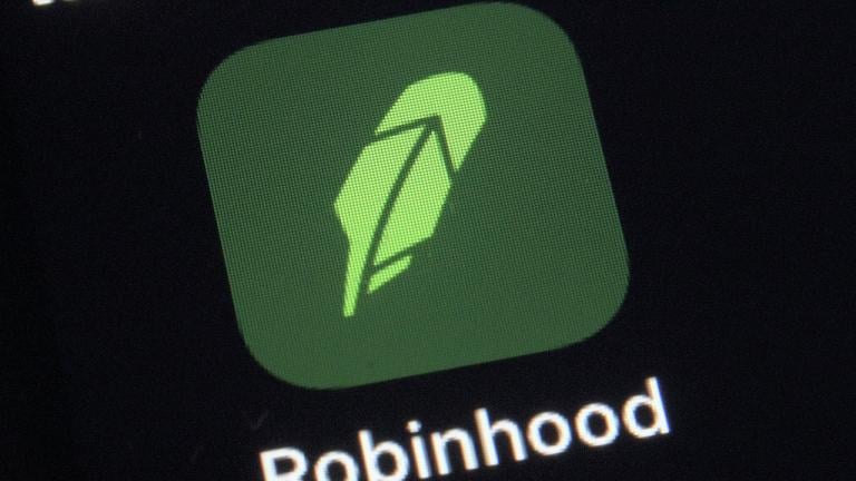 This Dec. 17, 2020 file photo shows the logo for the Robinhood app on a smartphone in New York. The online trading platform Robinhood is moving to restrict trading in GameStop and other stocks that have soared recently due to rabid buying by smaller investors. (AP Photo/Patrick Sison)