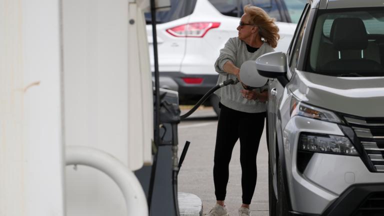 A woman fills her vehicle with fuel at a gas station, Monday, March 30, 2026, in Nashville, Tenn. (AP Photo / George Walker IV)