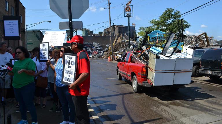 Southeast Side residents hold a press conference Monday, July 30, 2018 in front of General Iron’s scrap metal yard in Lincoln Park. (Alex Ruppenthal / Chicago Tonight)
