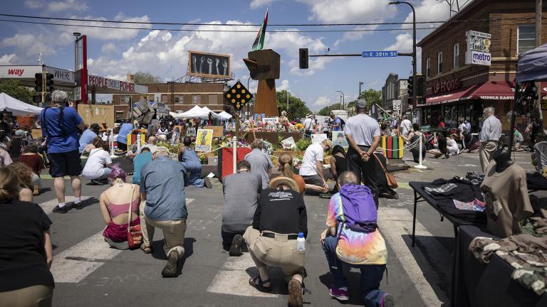 People take a knee during a moment of silence on the one year anniversary of George Floyd’s death on Tuesday, May 25, 2021, in Minneapolis, Minn. (AP Photo / Christian Monterrosa)
