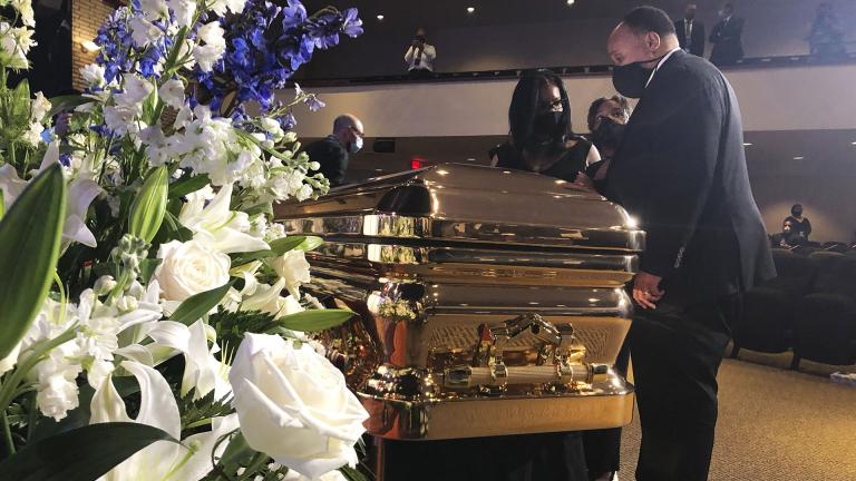 Martin Luther King III takes a moment by George Floyd’s casket Thursday, June 4, 2020, before a memorial service for George Floyd in Minneapolis. (AP Photo / Bebeto Matthews)
