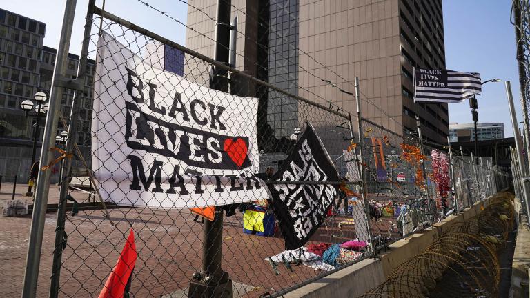 Black Lives Matter flags fly and line the fence surrounding the Hennepin County Government Center Friday, April 2, 2021 in Minneapolis where the trial for former Minneapolis police officer Derek Chauvin continues. (AP Photo / Jim Mone)
