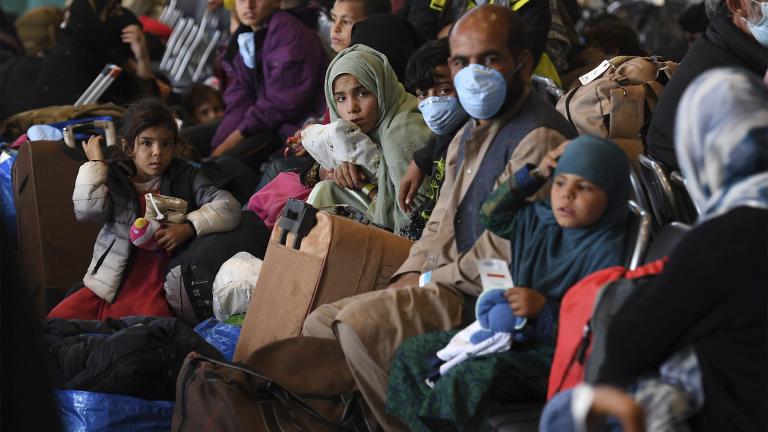 Afghan refugees are processed inside Hangar 5 at the Ramstein U.S. Air Base in Germany Wednesday, Sept. 8, 2021. (Olivier Douliery / Pool Photo via AP)