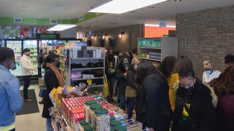 Residents and community leaders gather for the opening of new Go Green Community Fresh Market in Englewood March 8, 2022. (WTTW News)