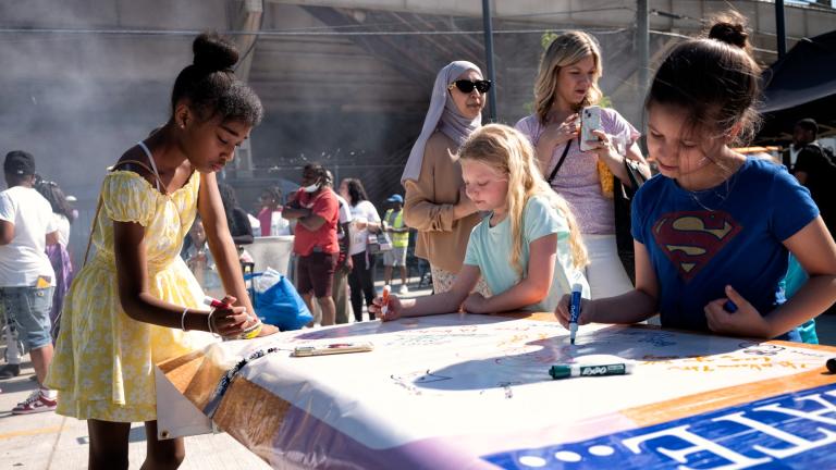 Children making art at IMAN’s grand opening of Go Green Griot Plaza, where its Arts for EveryBody event will take place Saturday, July 27, 2024. (Courtesy of Arts for EveryBody / Scout Tufankjian)