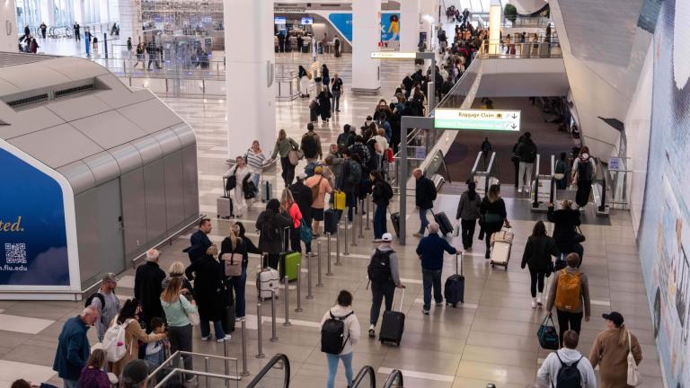 People wait in line at a Transportation Security Administration (TSA) security checkpoint at LaGuardia Airport (LGA) in the Queens borough of New York, Sunday, Nov. 9, 2025. (AP Photo / Adam Gray)
