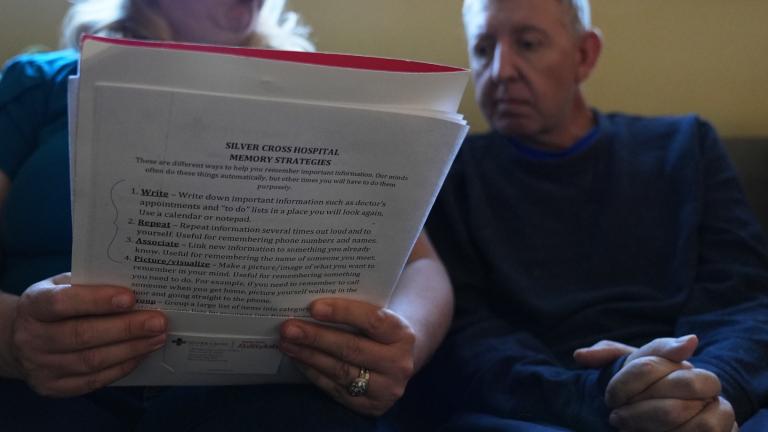Bill Swick, right, studies with his wife Martha Swick at their home in Minooka, Ill., Friday, Oct. 24, 2025. (AP Photo / Nam Y. Huh)