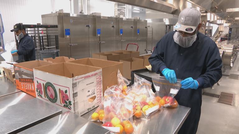 People work at the Greater Chicago Food Depository’s new facility. (WTTW News)
