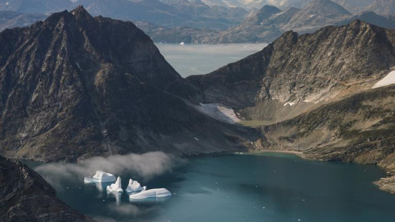 Icebergs are seen through a window of an airplane carrying NASA scientists as they fly on a mission to track melting ice in eastern Greenland on Aug. 14, 2019. (AP Photo / Mstyslav Chernov, File)
