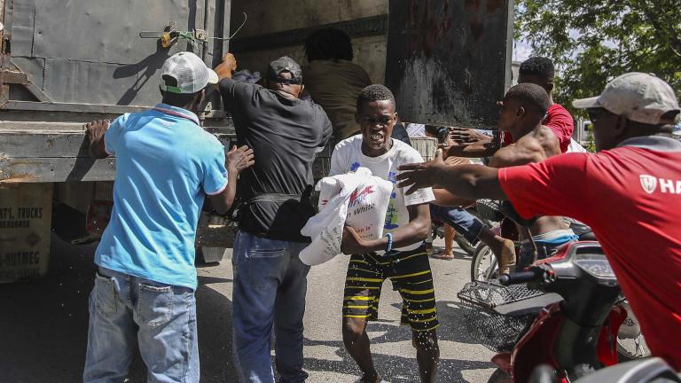 Rice is distributed to residents in Les Cayes, Haiti, Monday, Aug. 16, 2021, two days after a 7.2-magnitude earthquake struck the southwestern part of the hemisphere’s poorest nation on Aug. 14. (AP Photo / Joseph Odelyn)