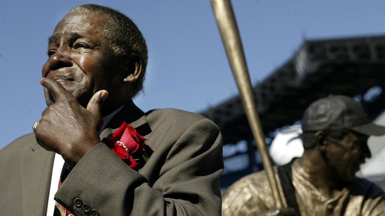 Minnie Minoso participates in the unveiling of a statue of himself before throwing out the ceremonial first fitch at U.S. Cellular Field before the game between Chicago White Sox and Detroit Tigers, Sunday, Sept. 19, 2004, in Chicago. Minoso has been elected into the Baseball Hall of Fame, Sunday, Dec. 5, 2021. (AP Photo/ Nam Y. Huh, File)