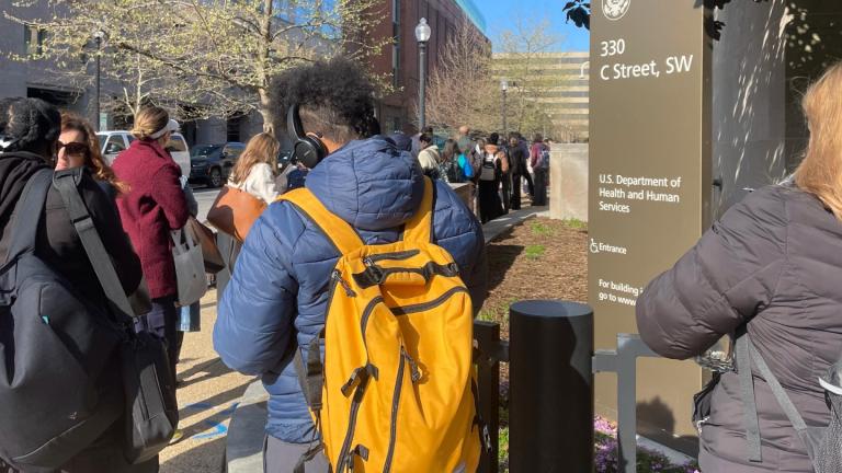 Hundreds of employees wait in line wrapped around the outside of the Health and Human Services headquarters building, Tuesday morning, April 1, 2025 in Washington. (AP Photo / Amanda Seitz)