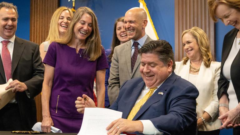 “Oh, I’m signed!” says state Sen. Laura Fine, D-Glenview, as she realizes that her bill giving the Department of Insurance new oversight authority had been approved by Gov. J.B. Pritzker on June 27, 2023. (Andrew Adams / Capitol News Illinois)