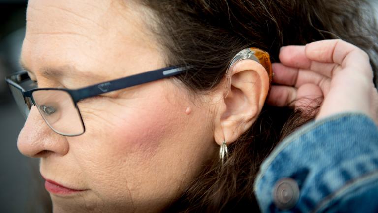 Kim M. Smith, leader of the Utah Deaf Hospital Rights movement and president of the Utah Association of the Deaf, brushes her hair away from her hearing aid as she poses for a portrait Monday, Jan. 20, 2020, at Alta View Hospital in Sandy, Utah. (Isaac Hale / The Daily Herald via AP, File)