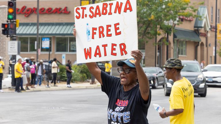 Volunteers from Saint Sabina Church distributed bottles of cold water to passing motorists at a busy South Side intersection in Chicago, Aug. 27, 2024. (AP Photo / Teresa Crawford, File)
