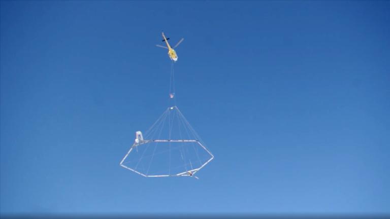 A helicopter hauling the type of sensor that will be seen flying over parts of Illinois, including the southern portion of the greater Chicago region. (U.S. Geological Survey)