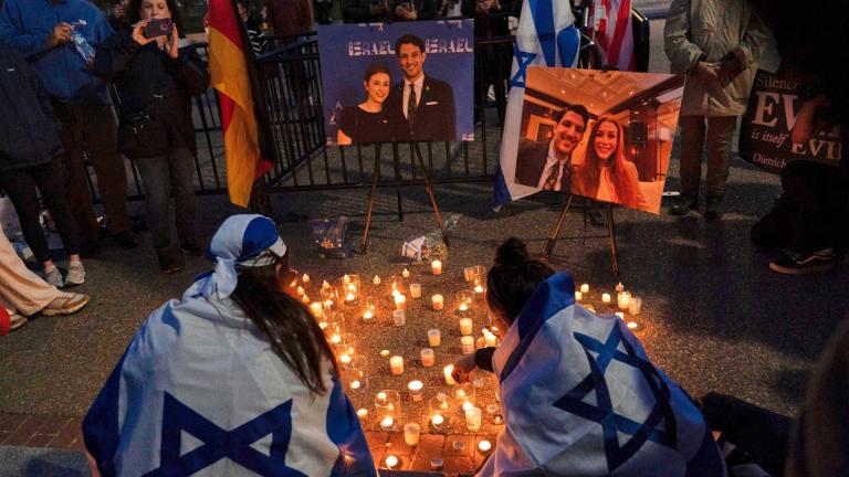 FILE - People gather to light candles in a makeshift memorial to honor Yaron Lischinsky and Sarah Milgrim who were killed as they left an event at the Capital Jewish Museum in Washington, during a candlelight vigil outside of the White House in Washington, Thursday, May 22, 2025. (AP Photo / Jose Luis Magana, File)
