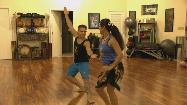 Ale Gabino and David Acevedo, owners of the Hōkūle’a Academy of Polynesian Arts. (WTTW News)