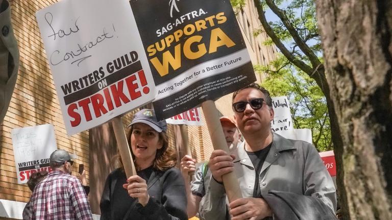 Actors and comedians Tina Fey, center, and Fred Armisen, right, join striking members of the Writers Guild of America on the picket line during a rally outside Silvercup Studios, Tuesday May 9, 2023, in New York. (AP Photo / Bebeto Matthews, File)